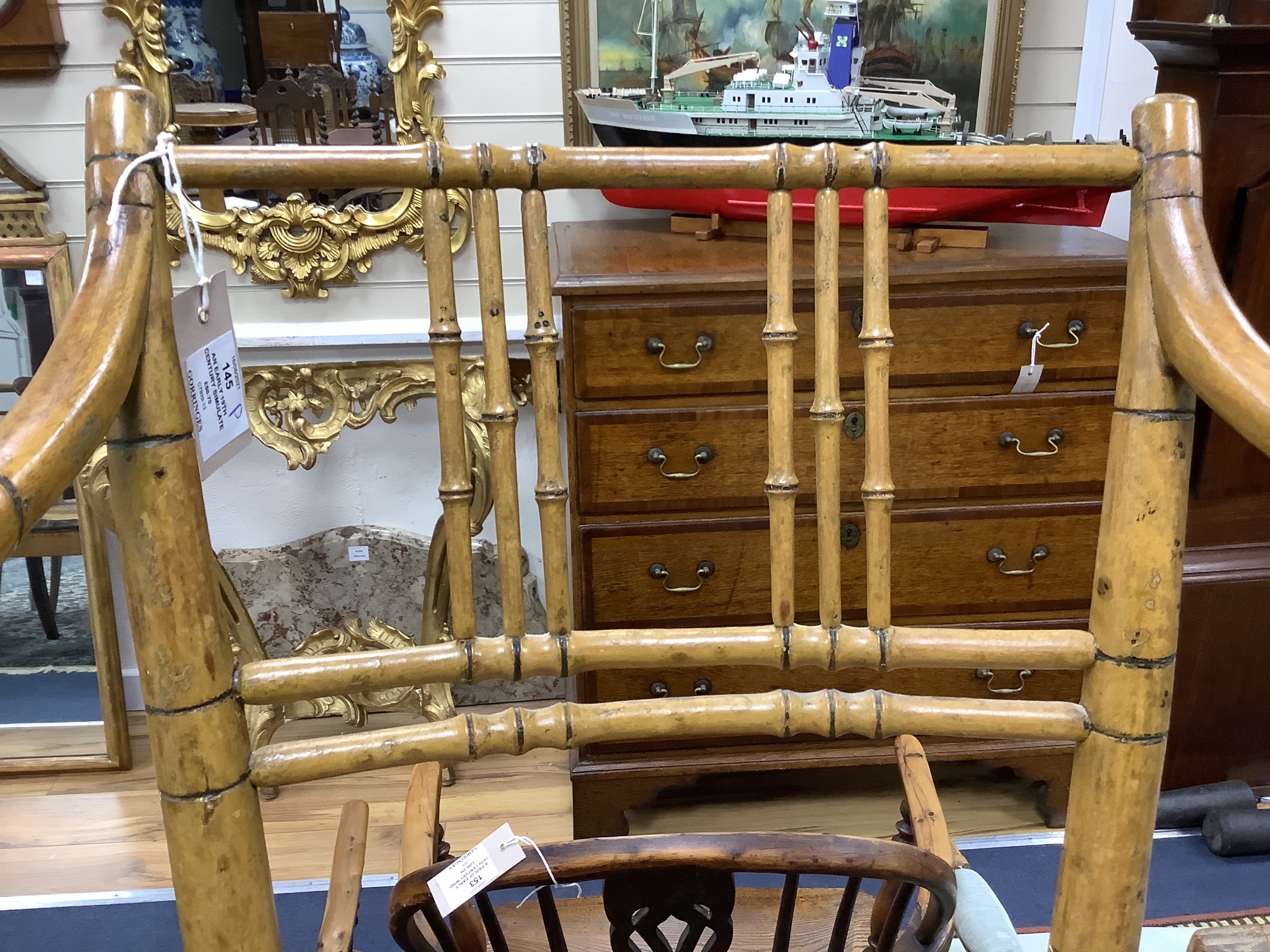 An early 19th century simulated bamboo elbow chair, cane seat